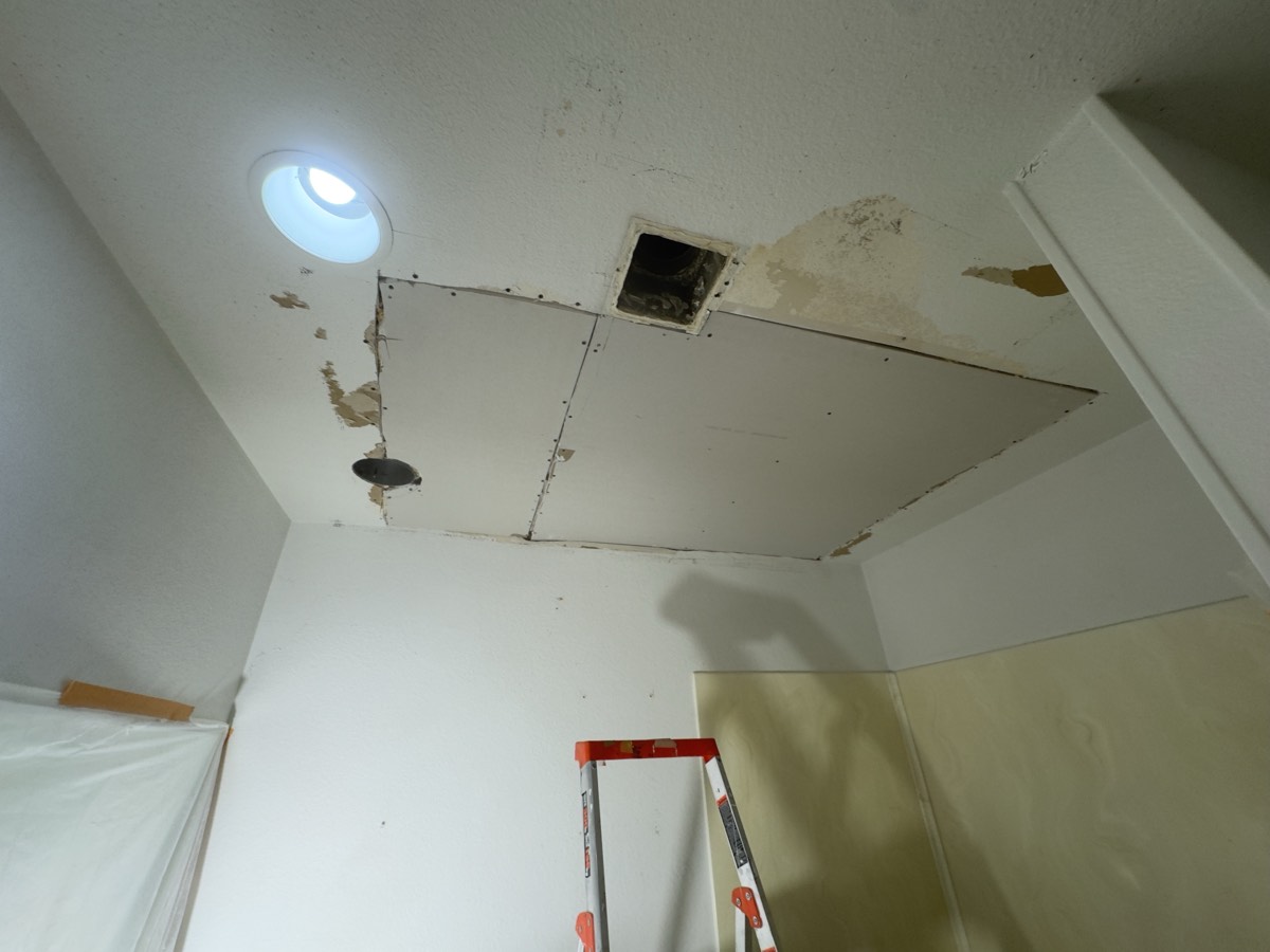 New drywall panels installed in the ceiling
